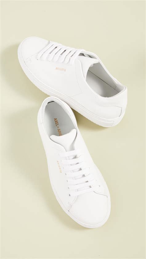 axel arigato white sneakers